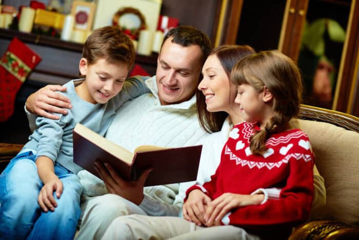 family reading the best Christmas picture books together